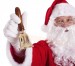 Santa's brass bell with wooden handle - in hand